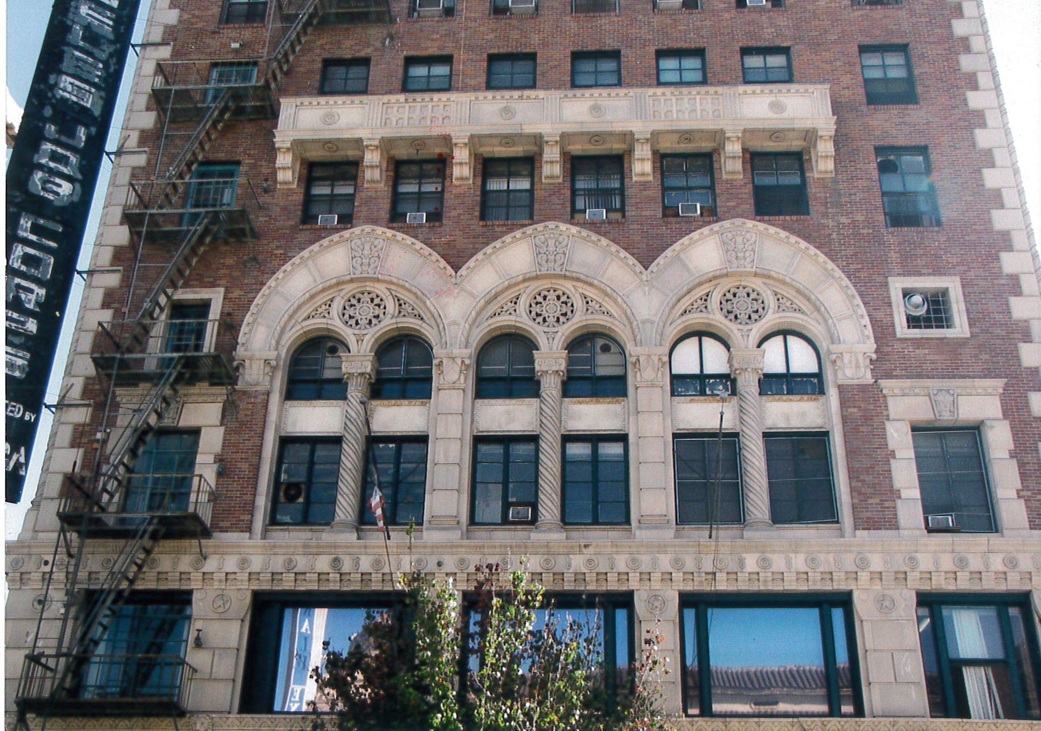 Close up of windows, brick and terra cotta details